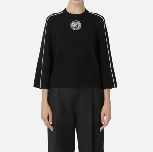 Elisabetta Franchi Maglieria E Felpe^Maglia cropped in viscosa con patch logo Nero/Burro